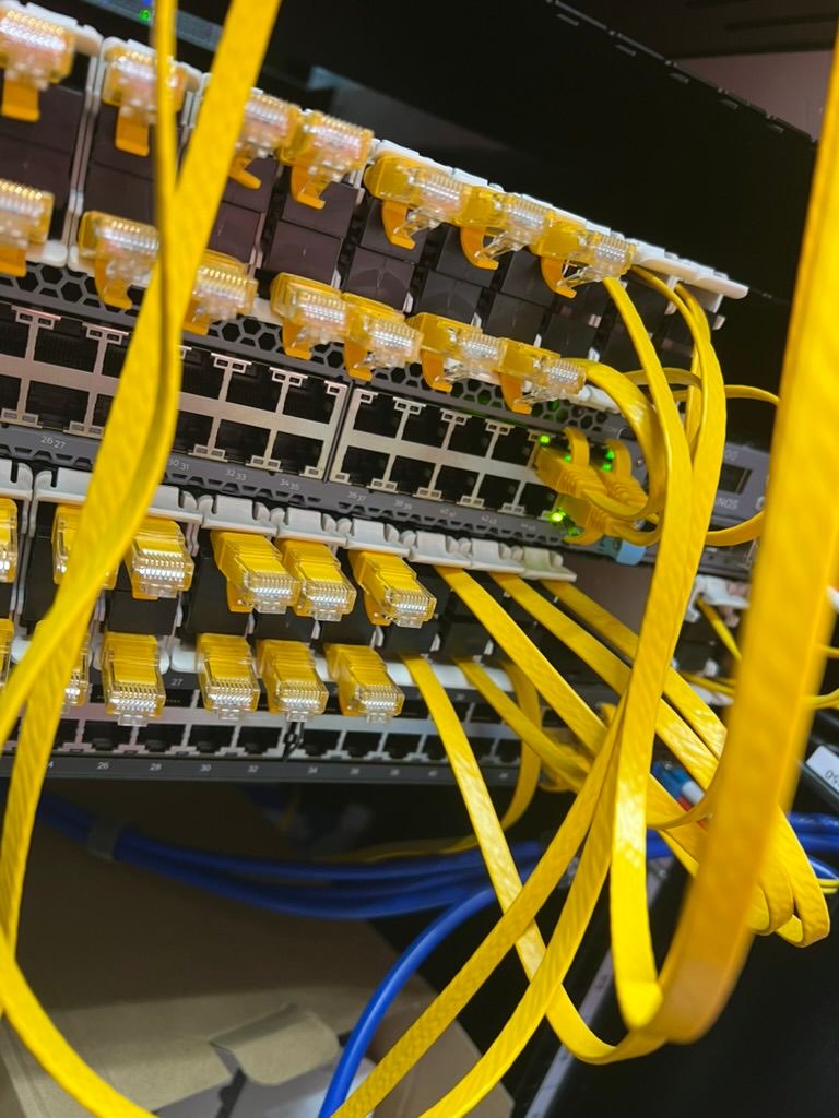 Patched switch ports and structured cabling in a UKNode rack in Manchester.